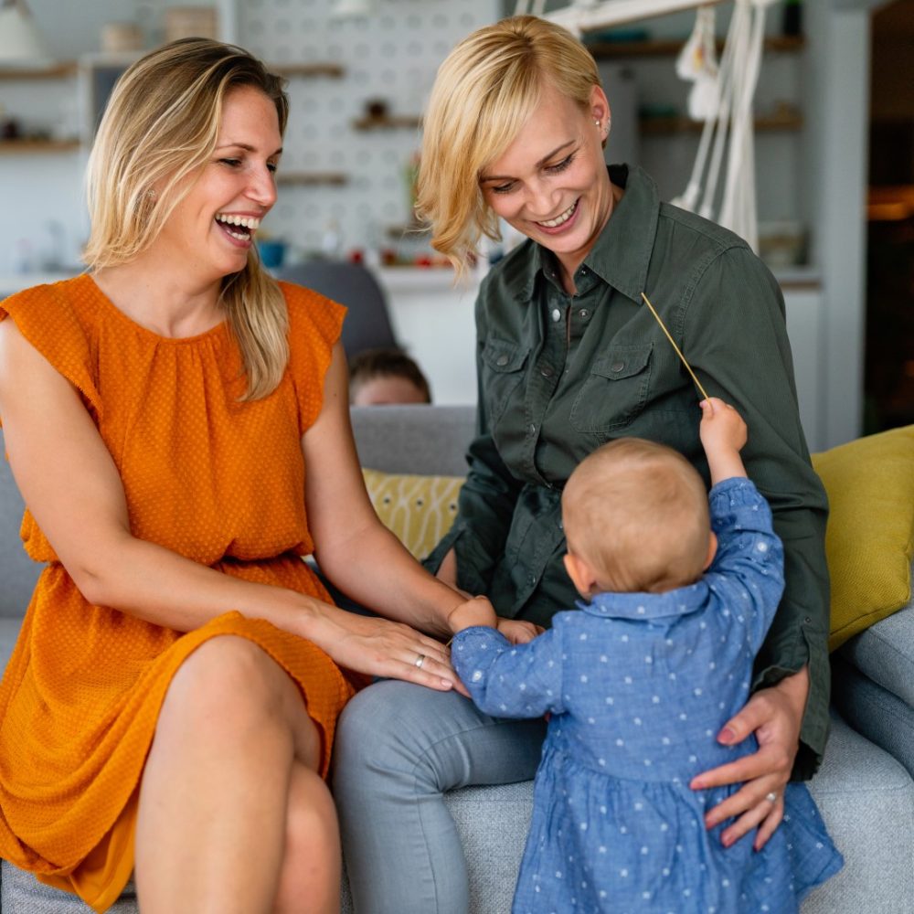 happy-lesbian-female-couple-with-her-little-child-2022-02-01-22-36-25-utc